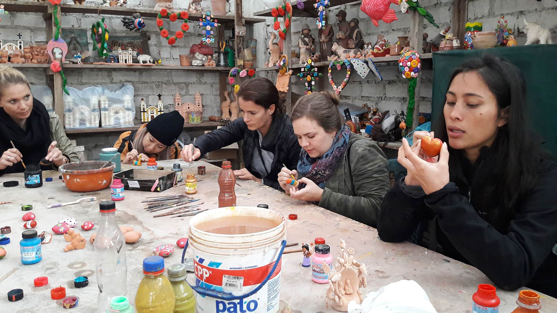 Travelers enjoying an art workshop with local artisans from Pachacamac - RESPONSible Travel Peru