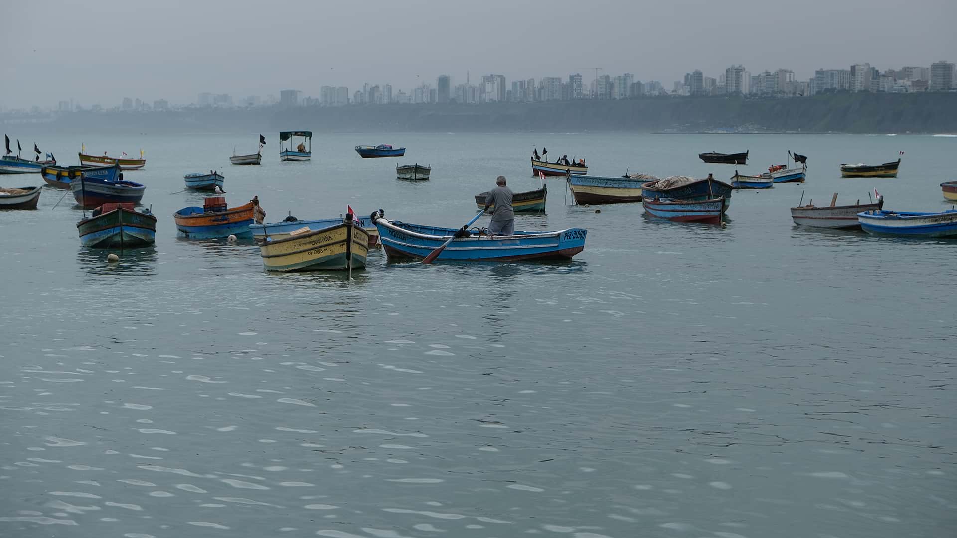 Fishing boats anchored at Chorrillos bay | Responsible Travel Peru