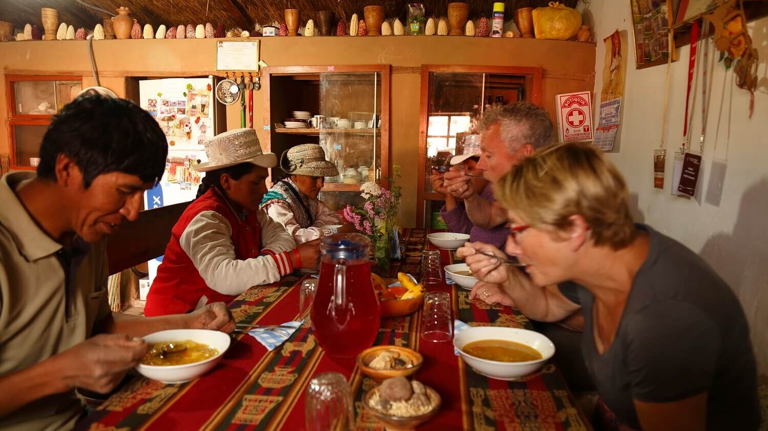 Travelers enjoying a typical meal in Coporaque, Colca Canyon. Community-based tourism in Peru with RESPONSible Travel Peru.