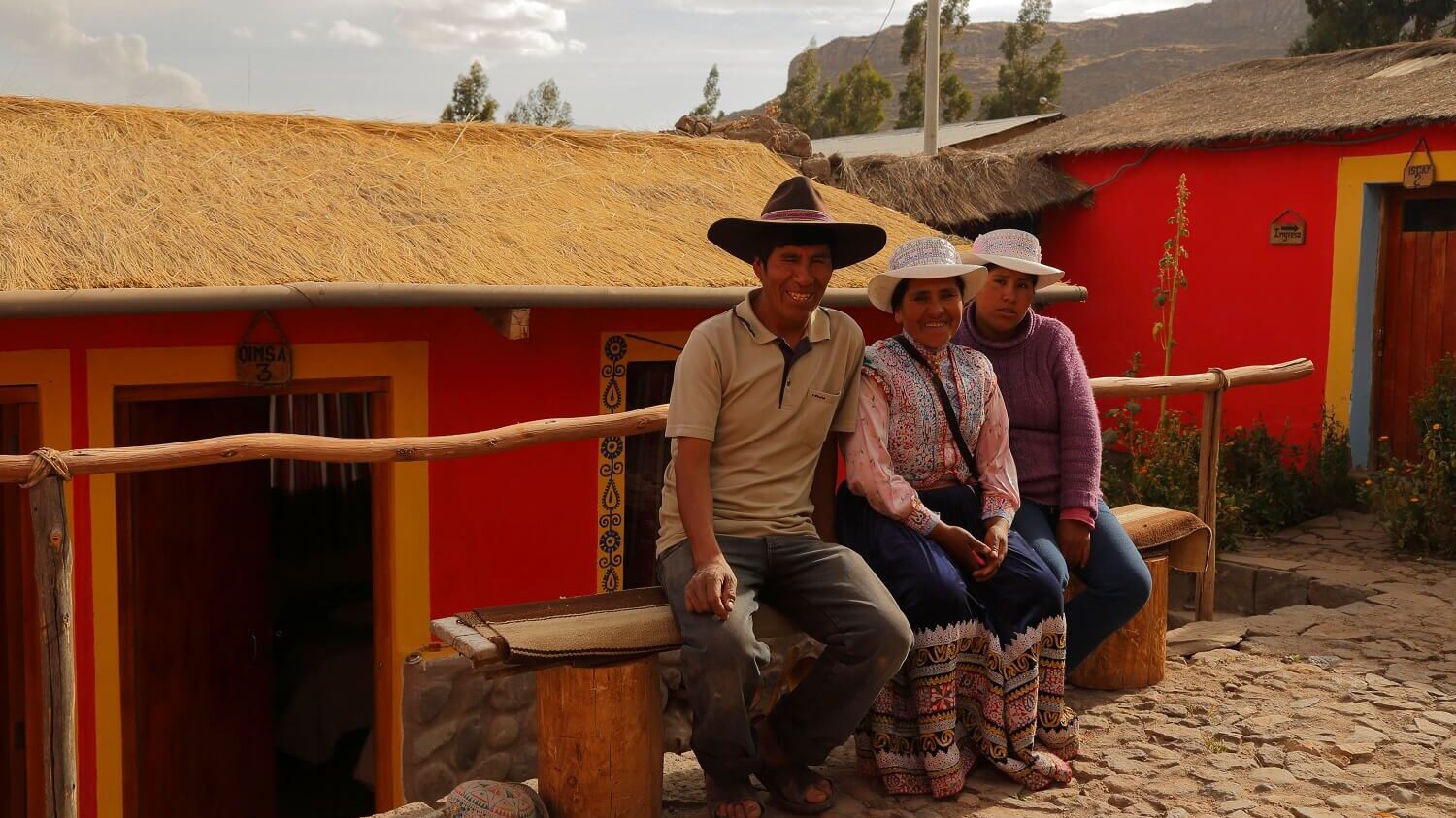 Sebastian and Jesusa with their daughter welcome visitors in their family home in Coporaque, Colca Canyon, Peru. Community-Based Tourism with RESPONSible Travel Peru.
