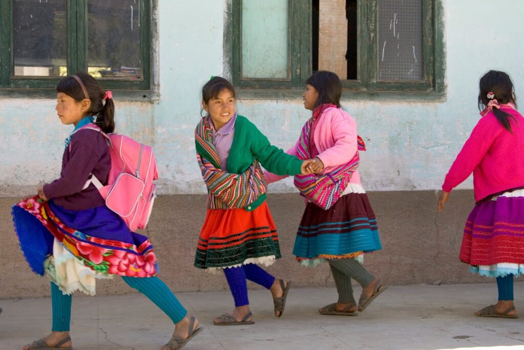 School girls in traditional dresses in Vicos, Peru. The best community-based tourism of Peru | RESPONSible Travel Peru