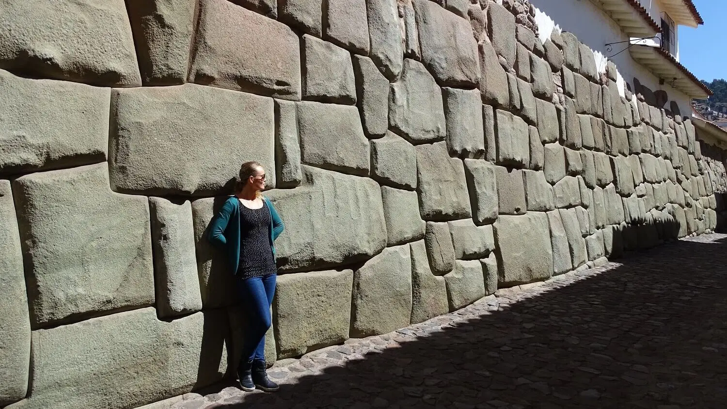 Agnes standing at a beautiful Inca wall in Cusco, Peru | RESPONSible Travel Peru
