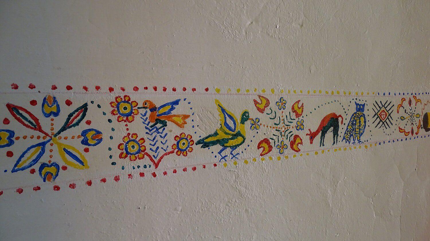 Decorations on the wall of a homestay in Sibayo. | RESPONSible Travel Peru