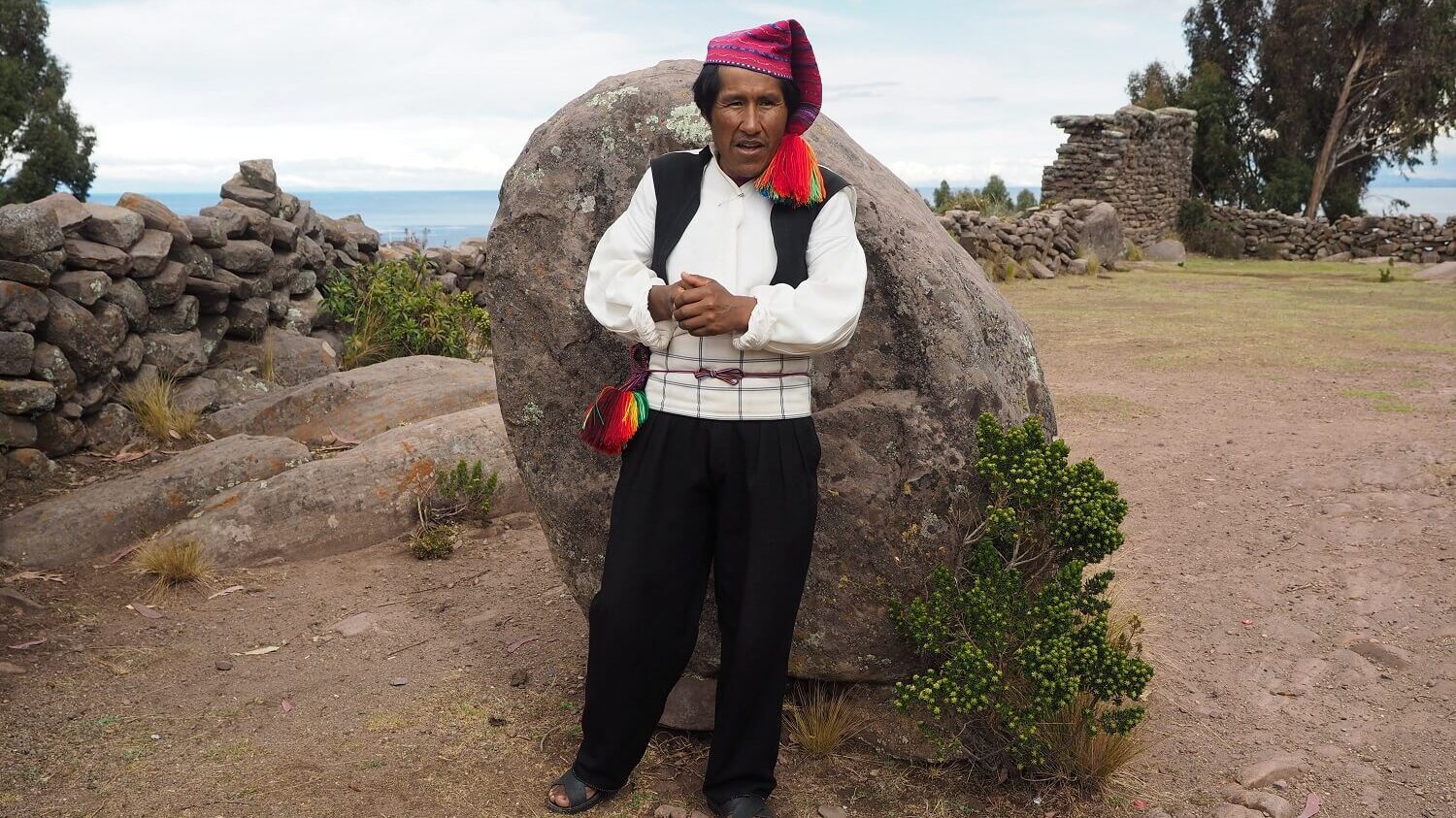 Homestay host from Taquile island in Lake Titicaca dressed in traditional clothes. Community-Based tourism in Peru with RESPONSible Travel Peru