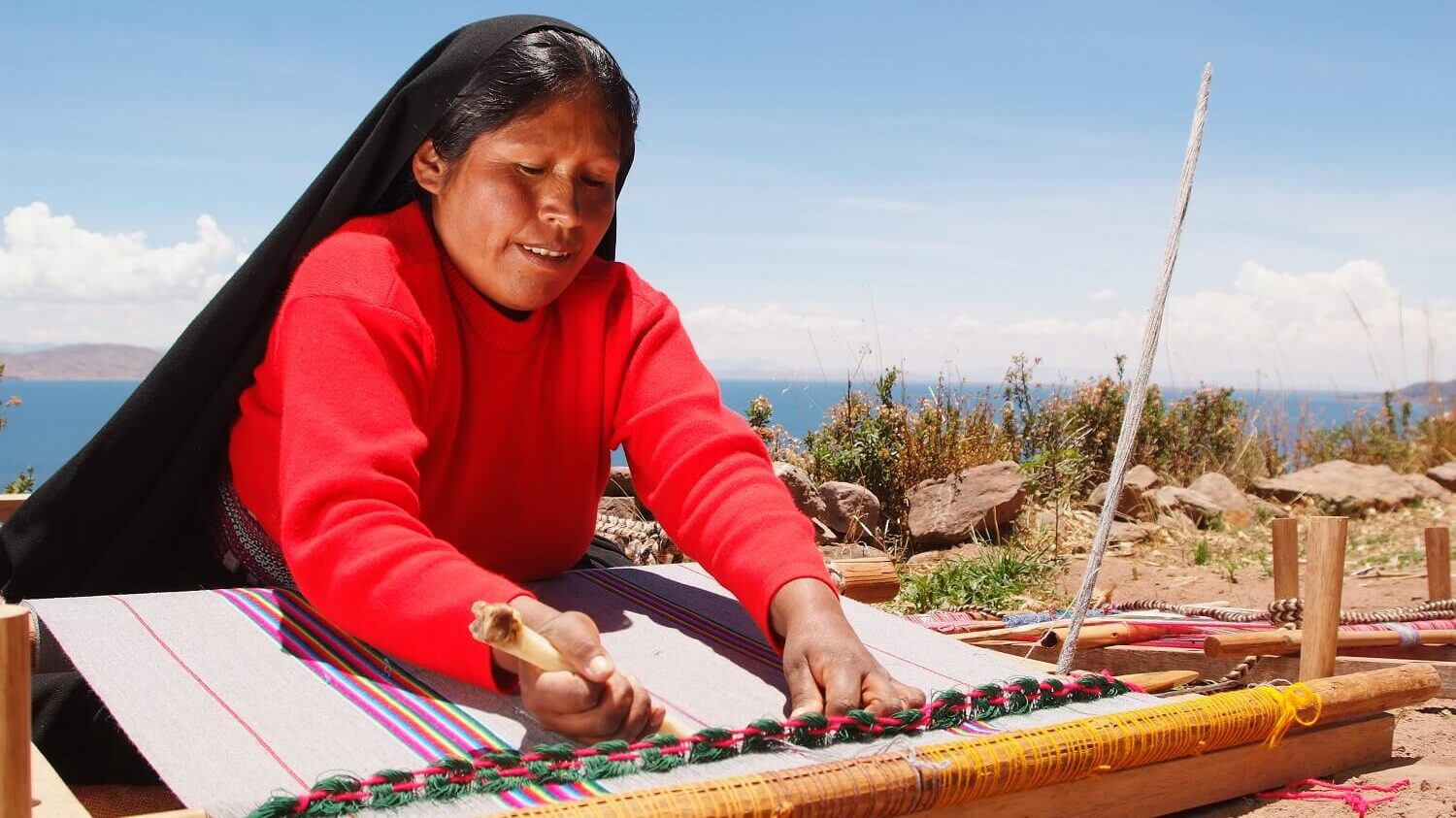 Weaving lady on Taquile island, Lake Titicaca, Peru. Community Based tourism in Peru with RESPONSible Travel Peru