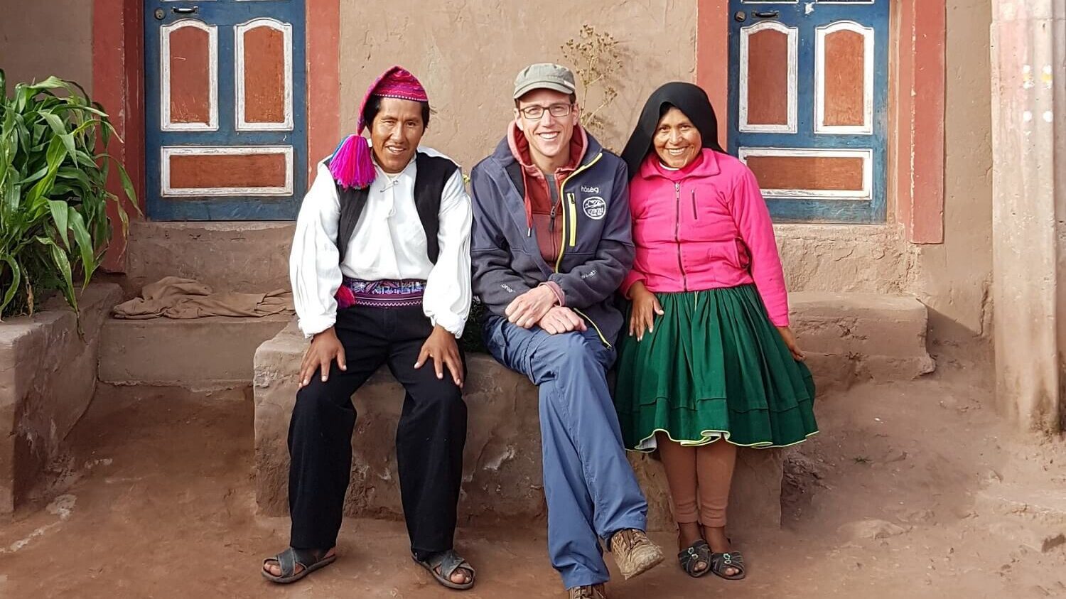Guido from RESPONSible Travel Peru with homestay hosts Celso and Juana on Taquile island