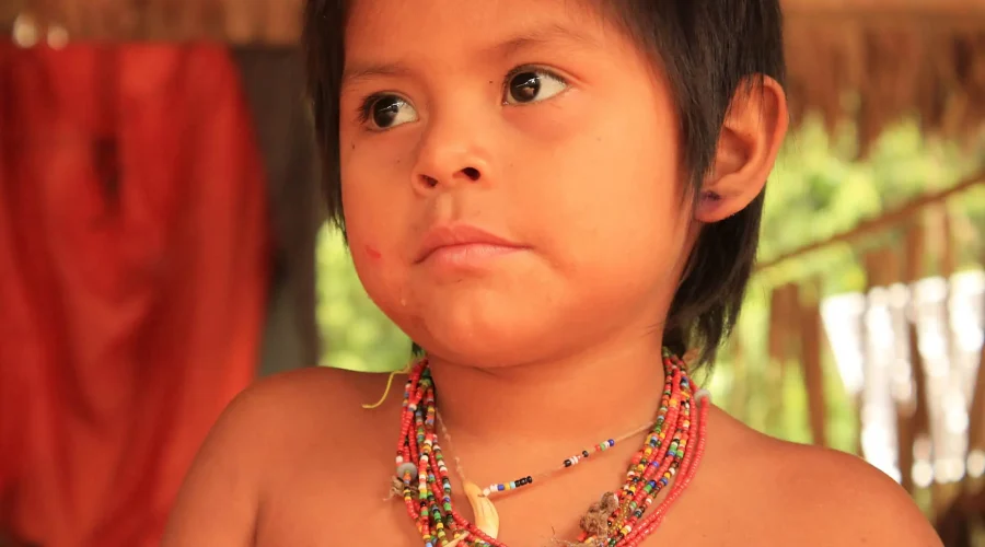 Child Matsiguenga posing for our photographer | Impactful Travel Peru