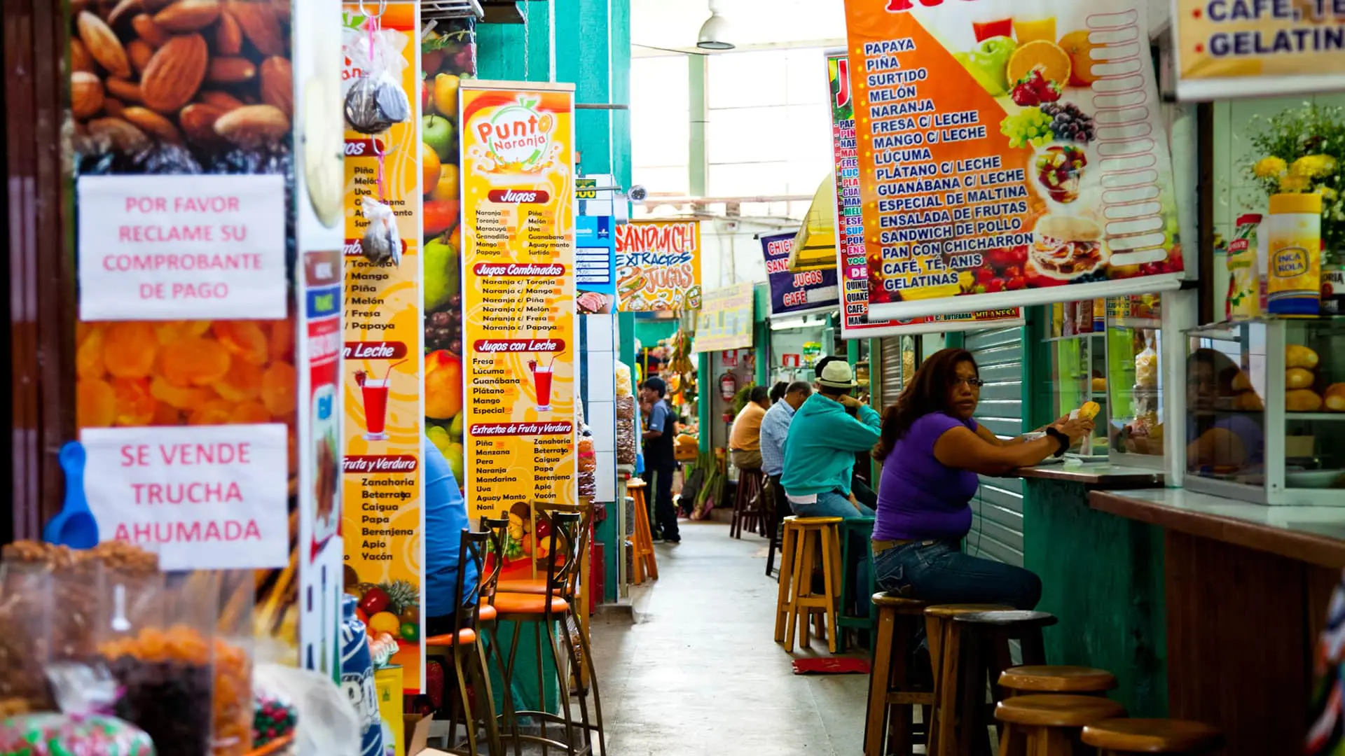 The market juices hall is colorful and busy at all times | Responsible Travel Peru