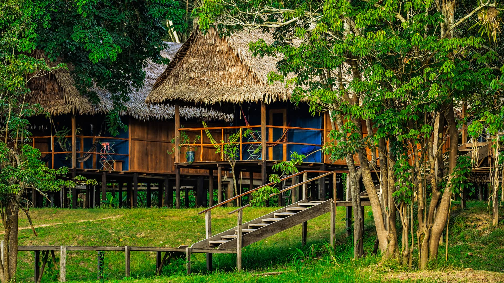 Traditional Amazonian buildings are characteristic of the lodge | Responsible Travel Peru