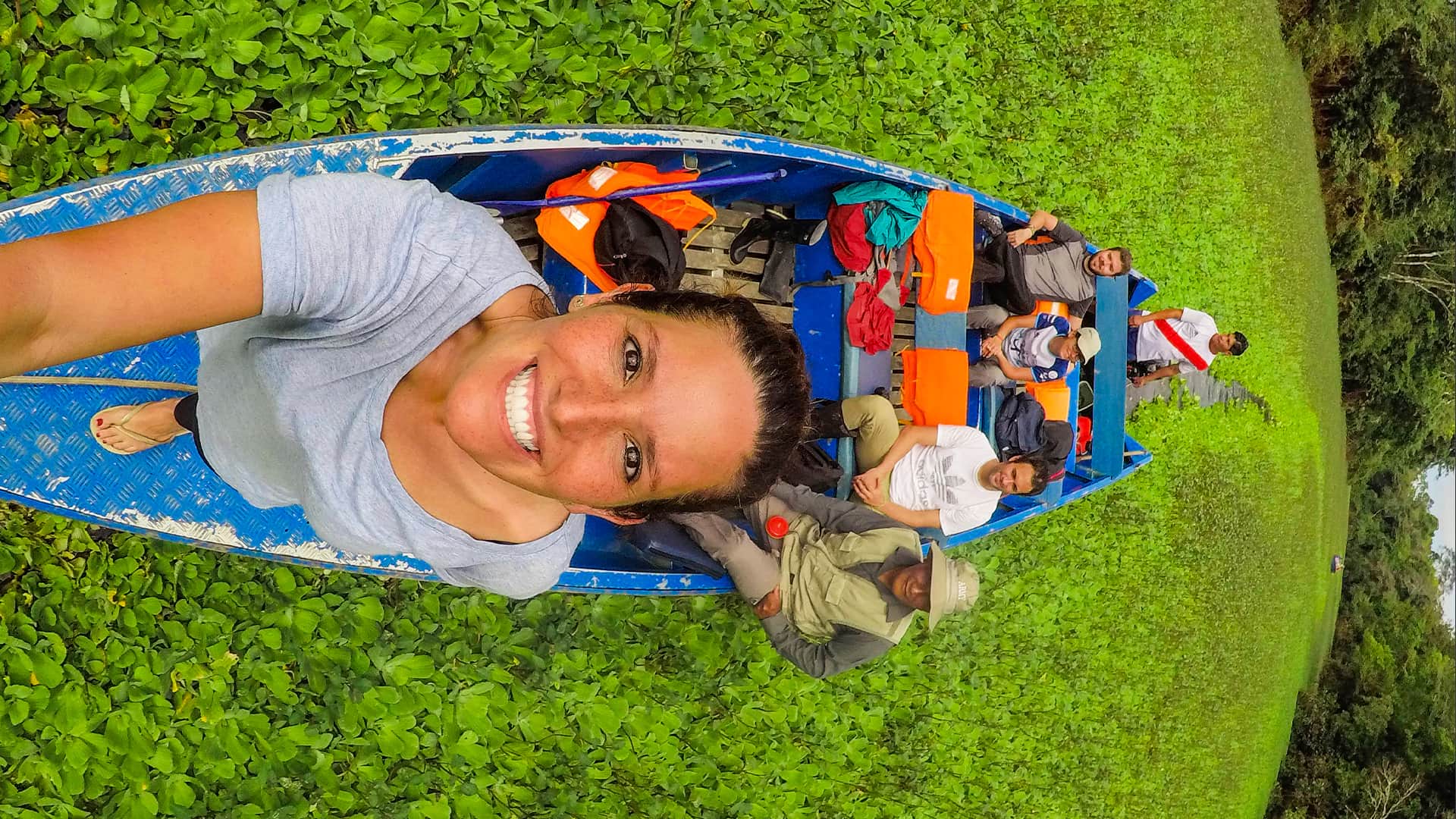 Selfie from the tip of the boat surrounded by aquatic vegetation | Responsible Travel Peru