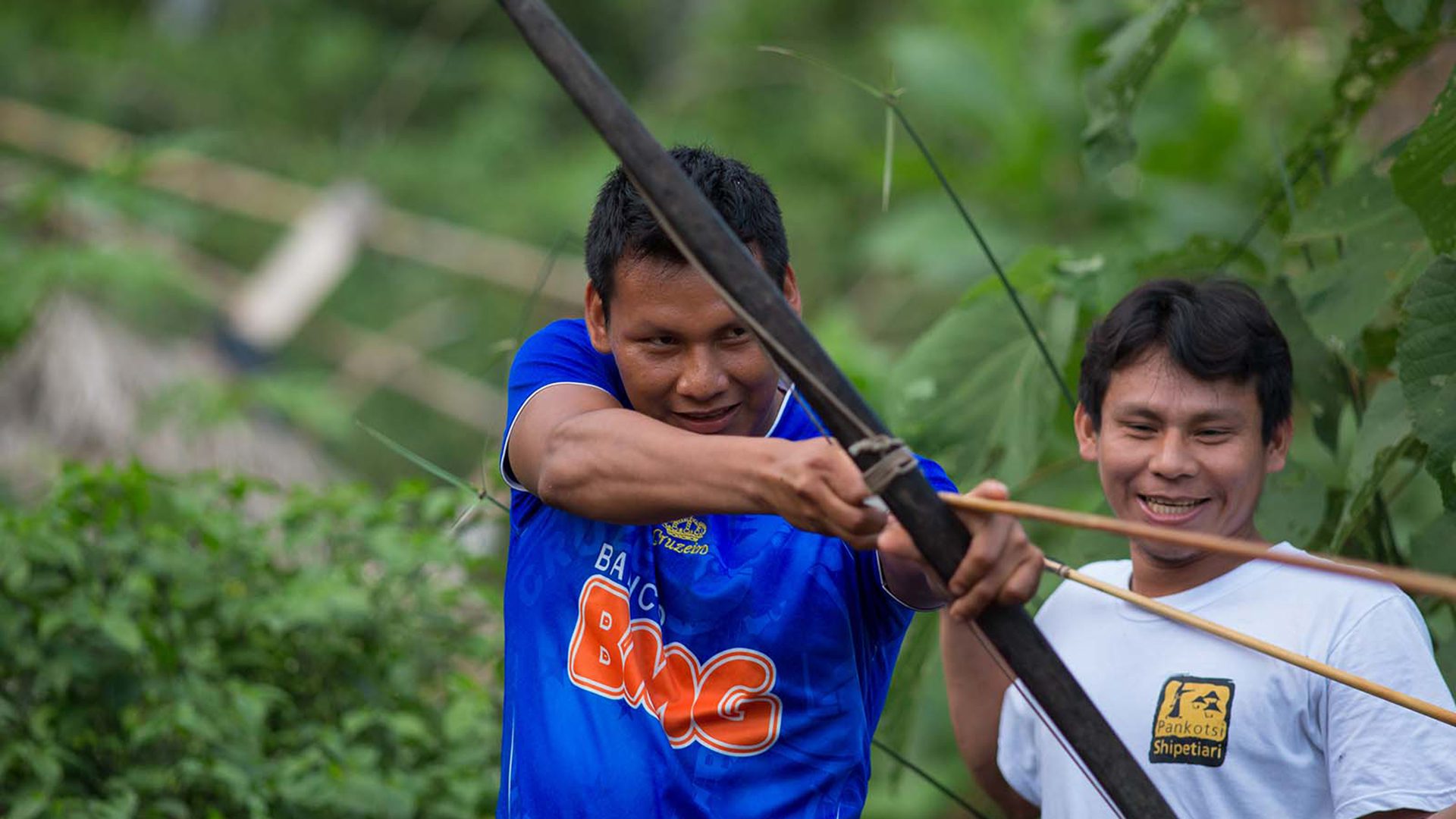 Young Matsigenkas show bow and arrow are used | Responsible Travel Peru