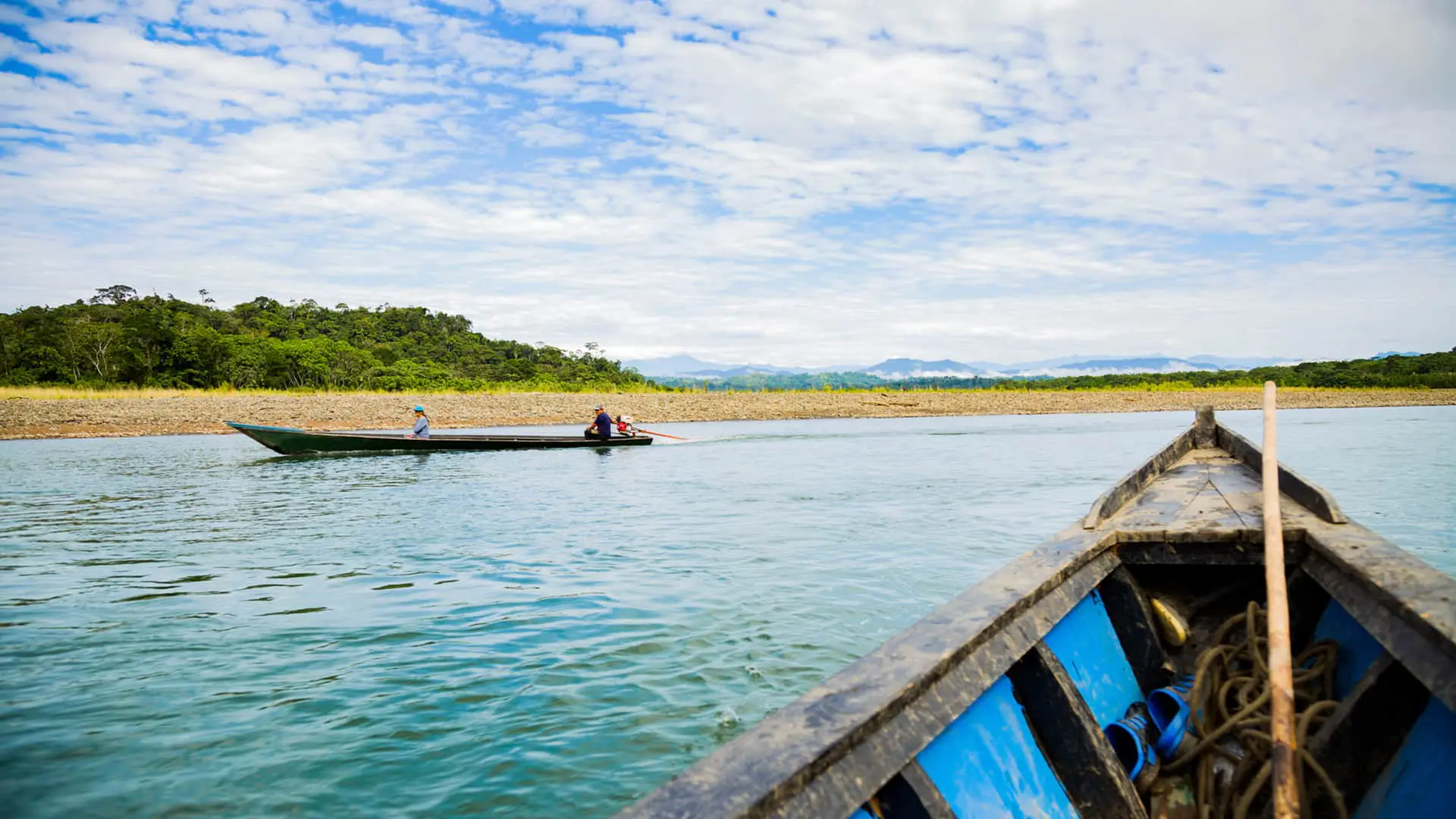 Boat view over the Alto Madre de Dios river departing from Shintuya's port | Responsible Travel Peru