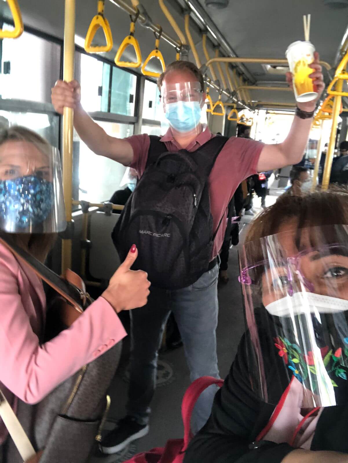 Travelers wearing mouth masks and face shield in public transportation in Lima, Peru | RESPONSible Travel Peru