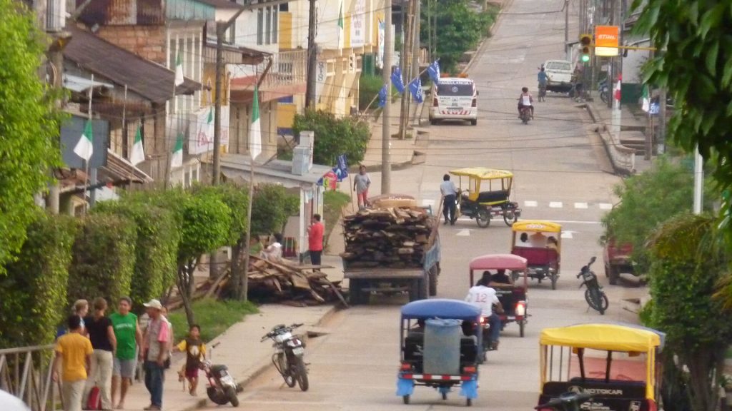 A view of one street of Iquitos mostly dominated by motorcycles | Impactful Travel Peru