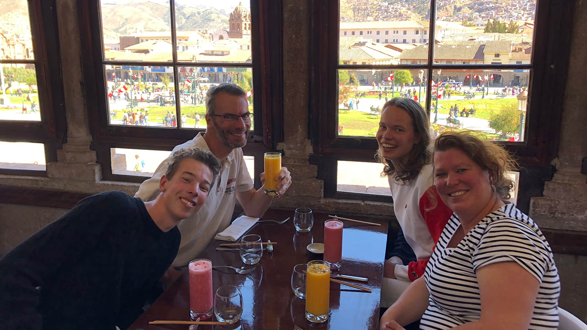 The Hefting family at a restaurant in Cusco with a view over the main square | RESPONSible Travel Peru