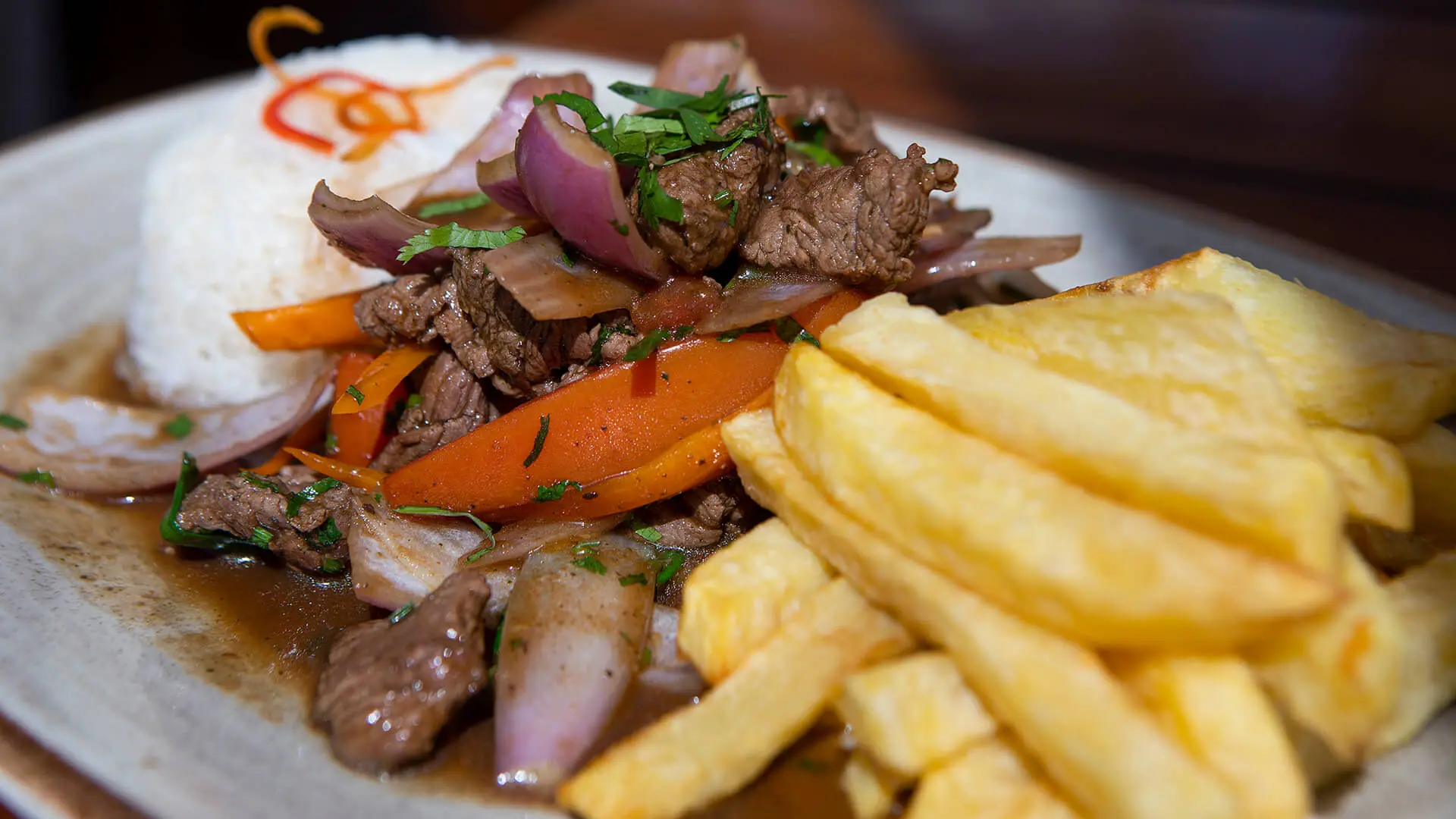 Close-up to a Lomo saltado, a Peruvian dish - RESPONSible Travel Peru