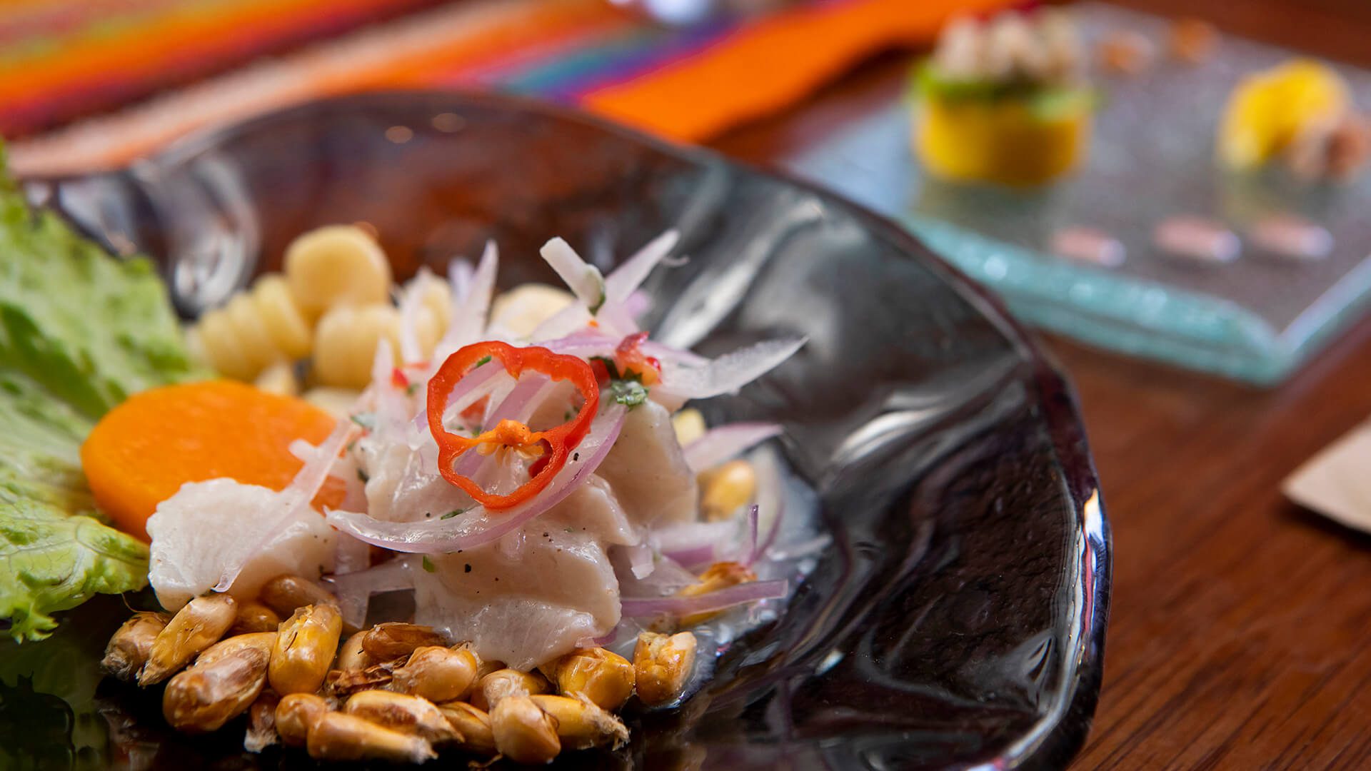 A close-up to a ceviche dish revealing all its ingredients - RESPONSible Travel Peru