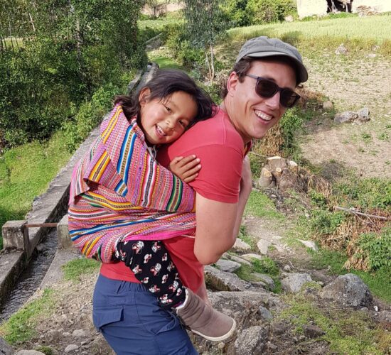 Guido from RESPONSible Travel Peru with his goddaughter Andrea in the community of Vicos