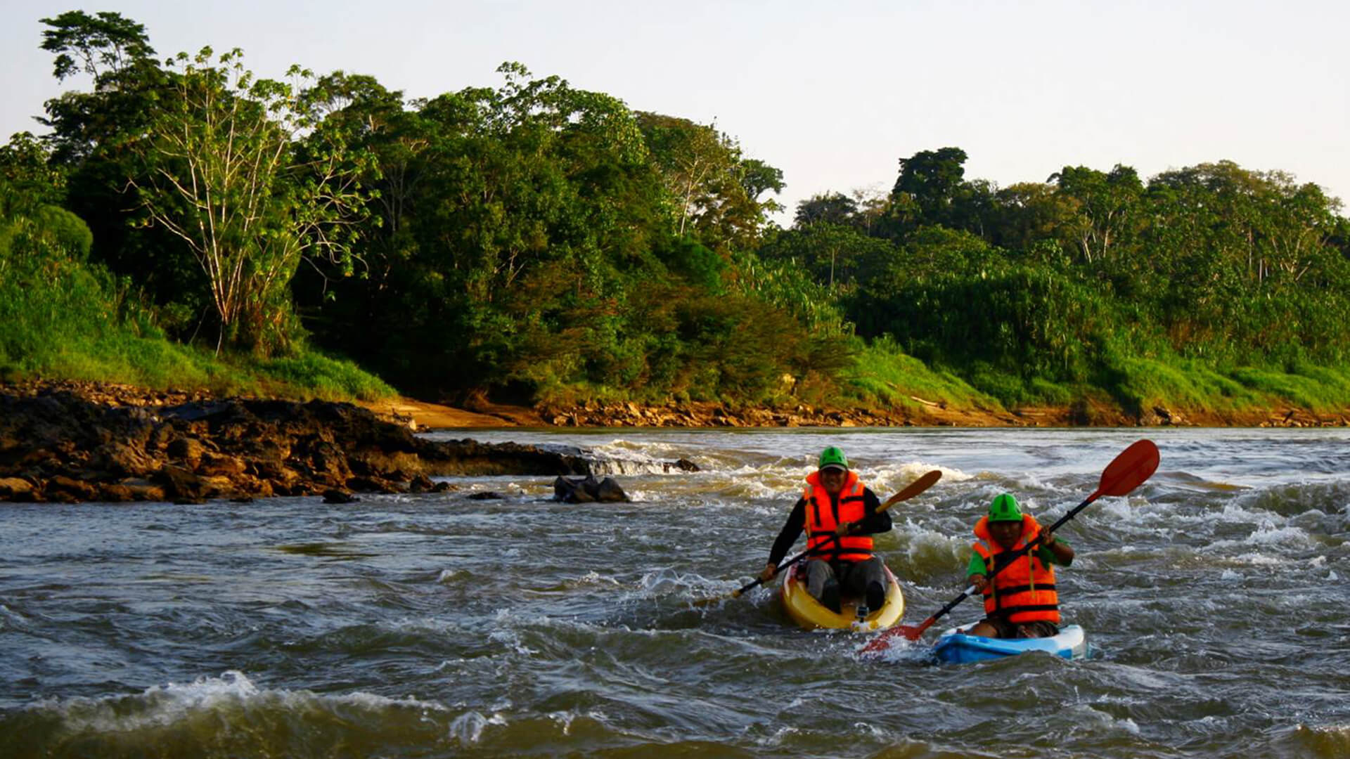 People kayaking through the Tambopata Rivers