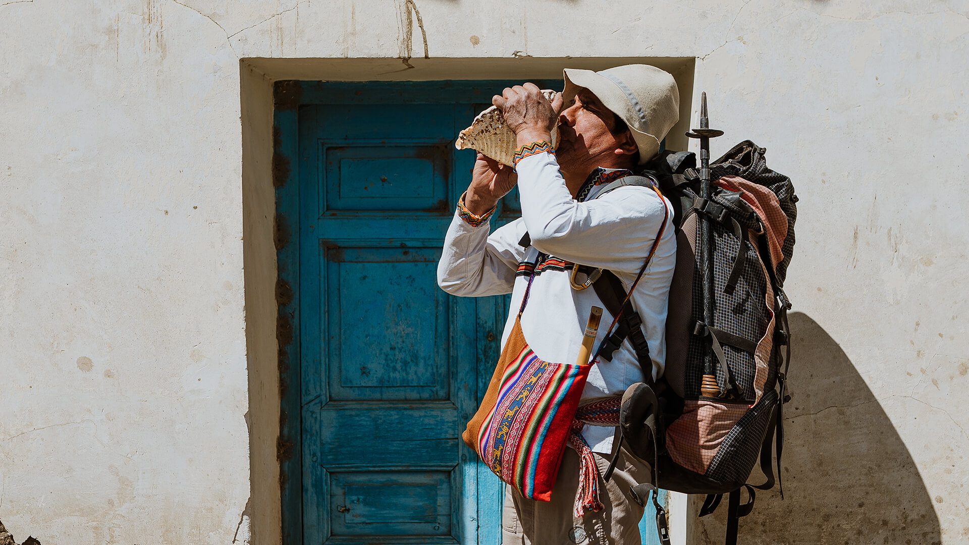 Man geared up with trekking equipment and local musical instruments | Llama Trek Olleros to Chavin with RESPONSible Travel Peru | Photo by Bjorn Snelders