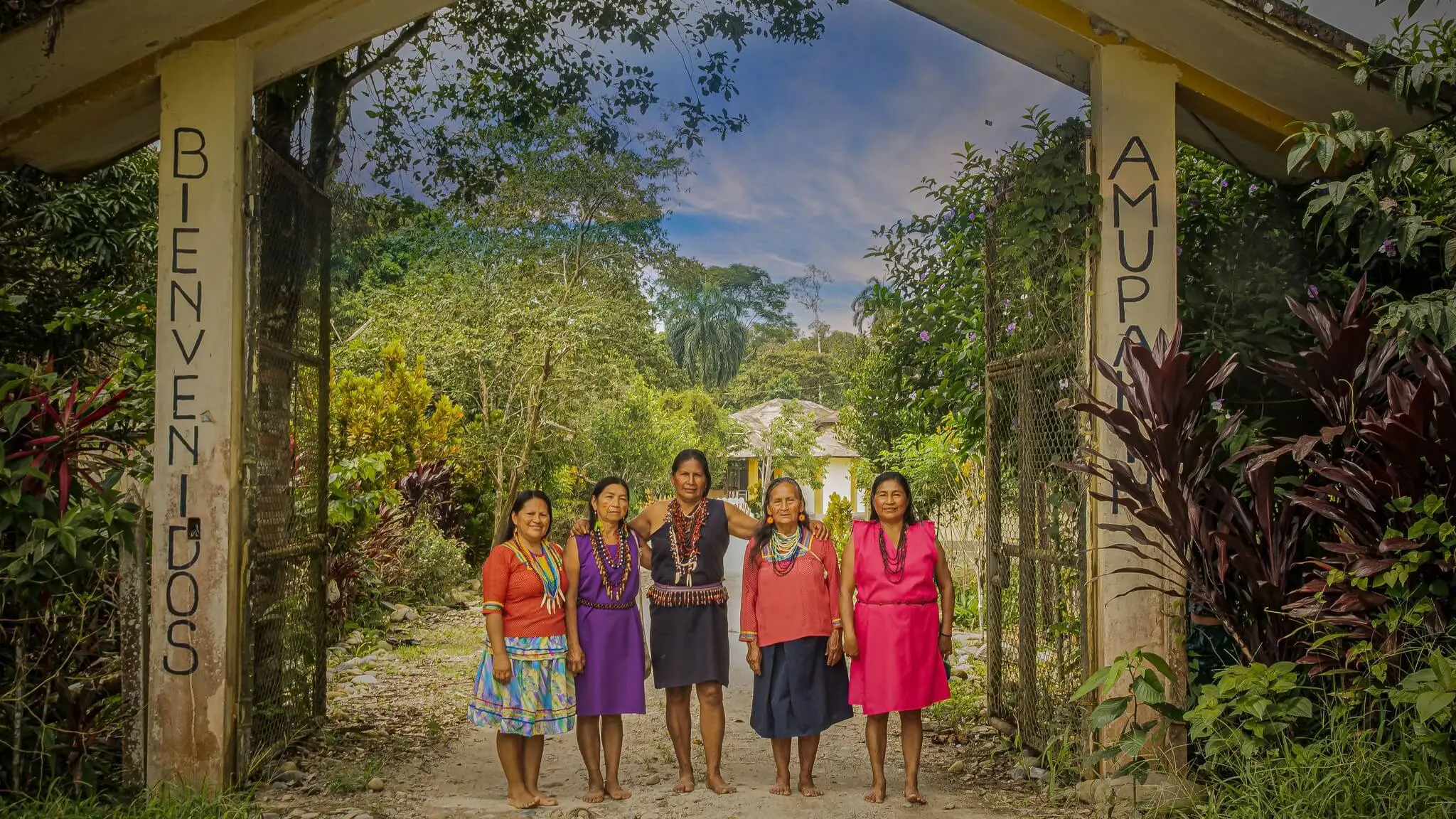 The achimamas, midwives, welcoming visitors to their Amupakin center to teach and share their wisdom about childbirth with ancient techniques and medicinal plants. | Impactful Travel in Ecuador