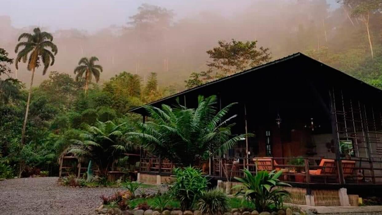 A misty morning image of the Kuyana amazon lodge in Ecuador | Impactful Travel