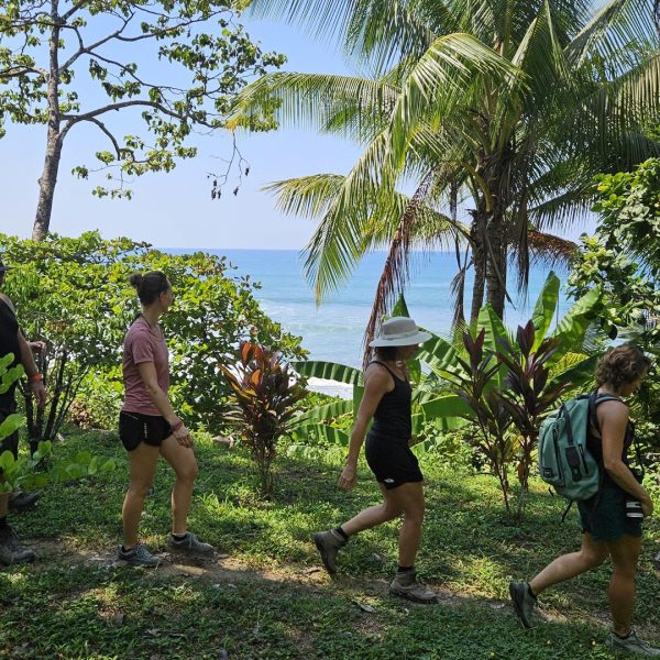 Well-prepared hikers equipped with boots, hats, and insect repellant make their way to La Leona Ecolodge | Impactful Travel Costa Rica